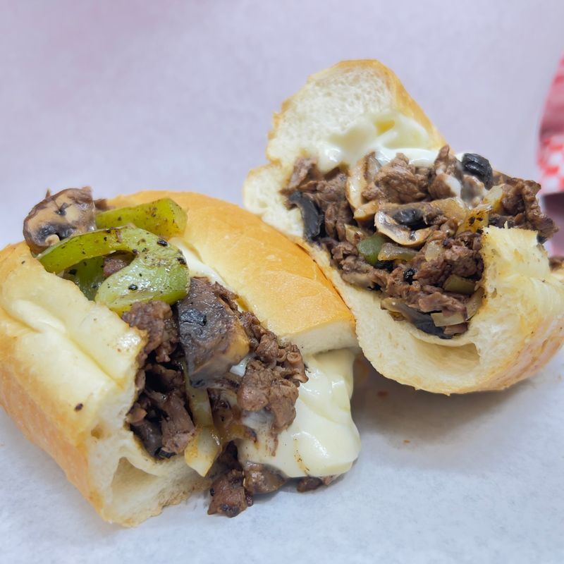 Chicago Cheesesteak with steak, peppers, mushrooms and melted cheese on a hoagie roll