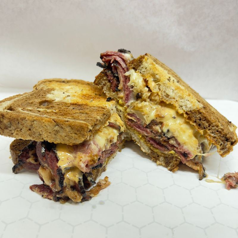 Reuben on toasted marble rye with pastrami, melted Swiss and sauerkraut